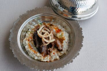 Shyra Restaurant lamb shank on milk-based keşkek, an Anatolian and Ottoman cuisine comparison